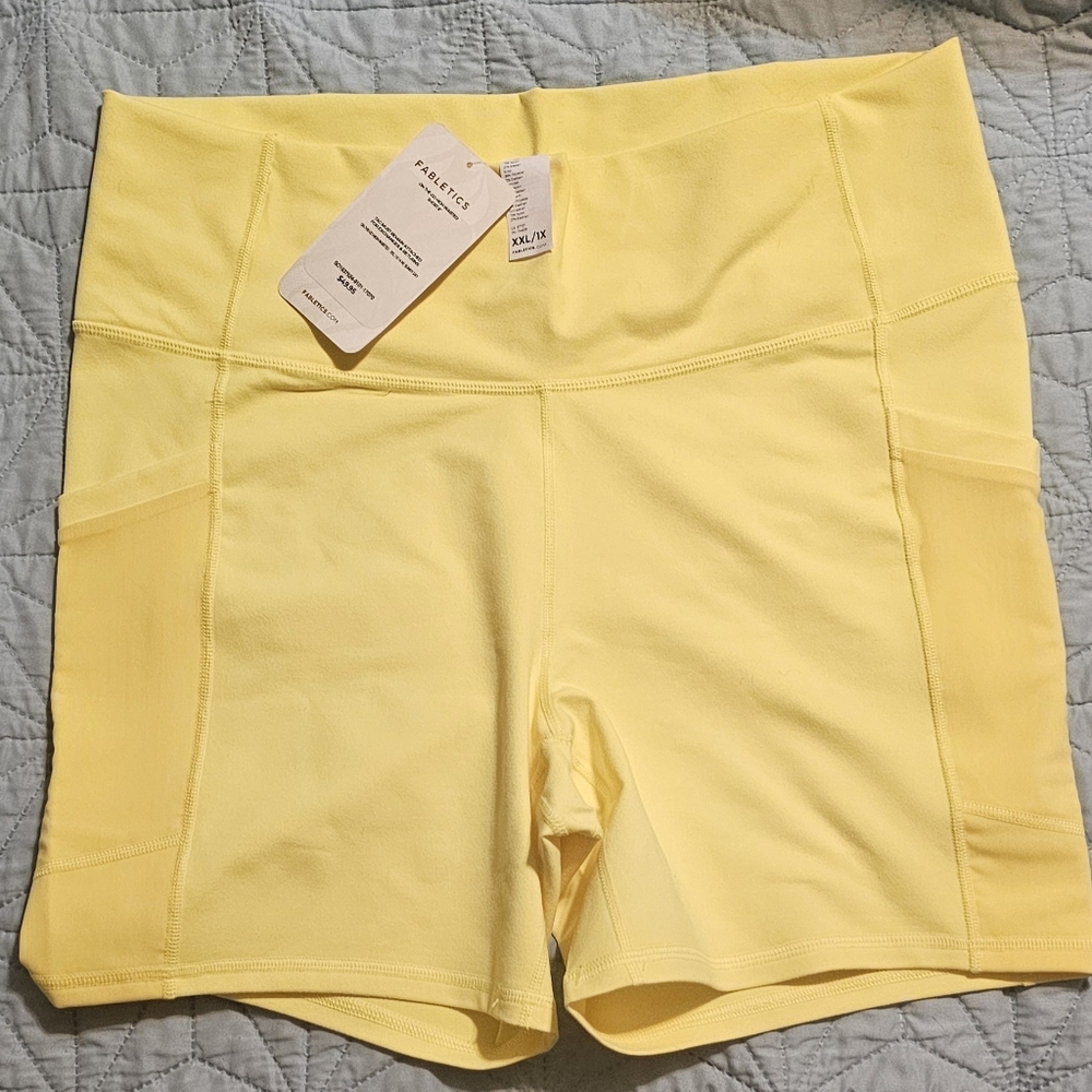 Fabletics powerhold shorts. Yellow with mesh pockets  New with tags  .XXL/1X.